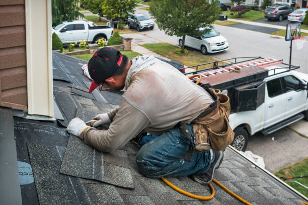Professional Roof Replacement technician working in Mannsville, NY